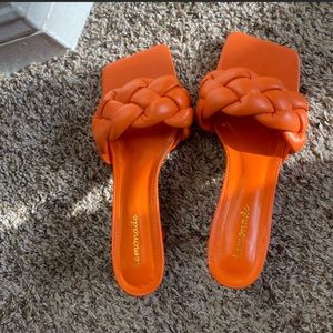 Orange braided heels